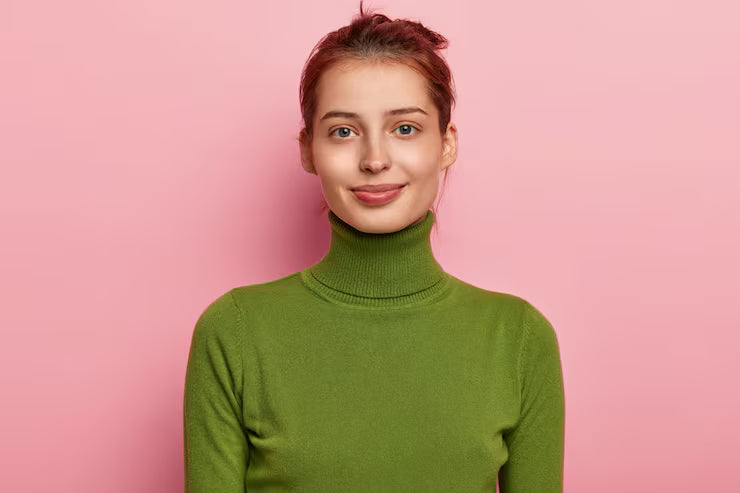 portrait-beautiful-young-lady-has-dark-combed-hair-appealing-appearance-wears-casual-green-turtleneck-looks-gladfully-into-camera-poses-against-pink-background_273609-32174 @ Happytoys Sexshop: online sex shop for Feeling Happy & Easy 😊 the erotic store owned by a woman
